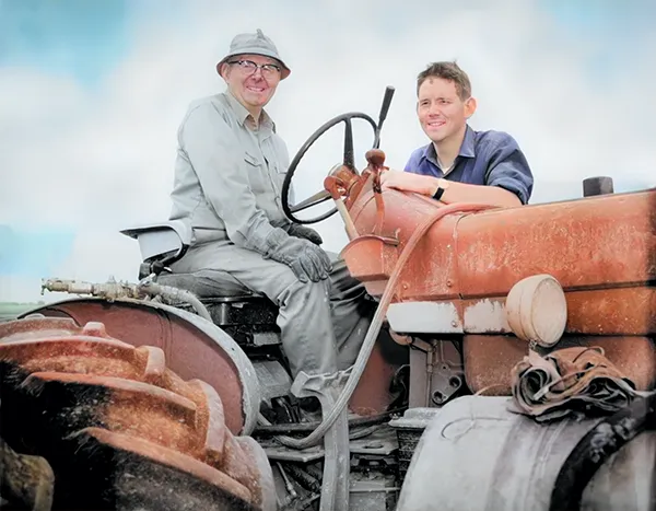 Photo Restoration Dad and son on tractor after