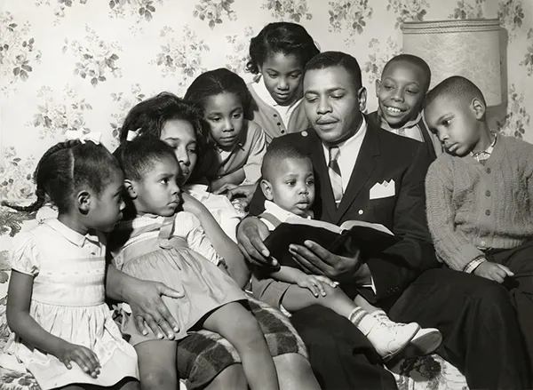 Photo Restoration Family photo reading after