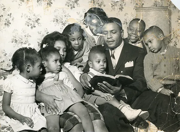 Photo Restoration Family photo reading before